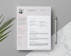 a clean and modern resume on a marble table