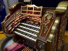 an old organ with many keys in it