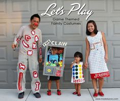 two adults and one child are standing in front of a garage door wearing costumes made to look like clowns