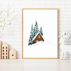 a print of a cabin in the snow with pine trees on it and a white brick wall