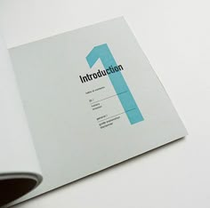 an open book with the number one printed on it's front and back cover