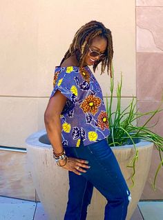 Our new unique Ankara top is made from African fabric 100% cotton. Wear this fun short Ankara top over pants, skirts, shorts, or jeans. Colors on print- gray, black, yellow and orange. Our items will be specially handmade to order in our studio upon ordering.  We are happy to answer questions regarding measurements. Maximum Length: Approximately 22" To shop our longer-length tops click below: https://www.etsy.com/shop/VeesFabDesigns?ref=seller-platform-mcnav&section_id=27870128 To purchase, place the item in your cart, and include at least your bust and hip measurements.   Our short top FEATURES:-  side slits, and a cute split neck design. For reference, the model is 5'7" and wears a Large Measurements Guide US "2" /UK "6" XXS Bust:31 Waist: 26 Hips: 34 US "4"/ UK "8" XS - Bust:32 Waist: 2 Tops Ankara, Ankara Blouse, African Blouses, African Tops, Ankara Tops, Pants Skirts, Womens Blouses, African Fabric, African Clothing