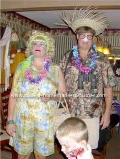 a man and woman in hawaiian clothing standing next to a little boy wearing a hat