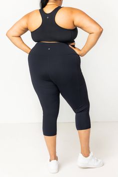 Our capri leggings with pockets are the original, the Superfit that started it all! This is our top-rated flagship product that revolutionized plus size activewear. Featuring our signature SuperHold™ compression fabric, two full size pockets, high supportive waist band, and the best plus size fit on the planet. Capris are the perfect, not too long and not too short, length and as soon as you put them on you'll know they were designed for YOUR body. *NY Times Wirecutter - Best Plus Size Leggings Functional Compression Activewear Capris, Black Activewear With Functional Pockets For Yoga, Black Yoga Activewear With Functional Pockets, Compressive Capris For Workout, Functional Workout Capris, Compressive Fit Workout Capris, Compressive Workout Capris, Sports Activewear With Pockets Capri Length, Moisture-wicking Capri Length Activewear