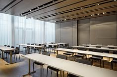 an empty classroom with desks and chairs