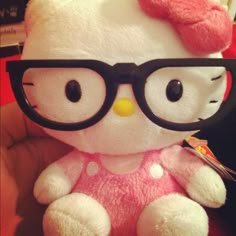 a hello kitty stuffed animal wearing glasses