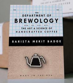 there is a lapel badge on top of a card that says, the department of brewoloy