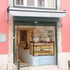 a bakery with lots of donuts in front of it