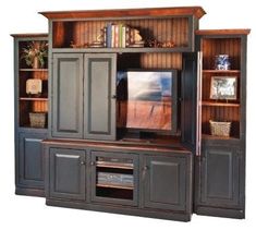 a large entertainment center with two doors and shelves