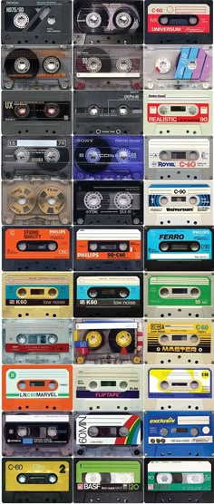 a large collection of cassette tapes stacked on top of each other in different colors and sizes