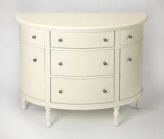 a white dresser with many drawers and knobs