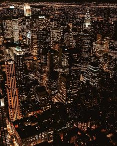 an aerial view of new york city at night from the top of the empire building