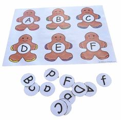 the gingerbread alphabet and numbers are displayed on a sheet of paper with stickers