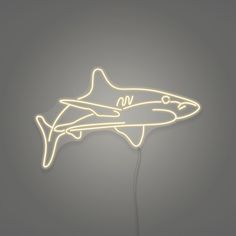 a neon sign with a shark on it