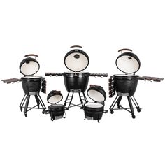 an assortment of black and white grills on stand with two large pots in the middle