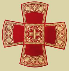 the cross is made up of red velvet and gold trimmings, with an intricate design