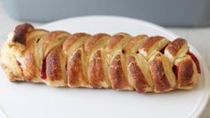 a white plate topped with pastry on top of a table