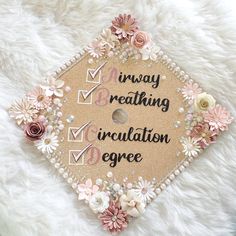 a graduation cap with flowers and words on it