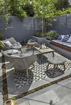 an outdoor living area with furniture and plants