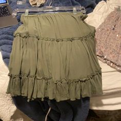 Never Worn, Fits Like A Small Green Ruffled Mini Skirt For Day Out, Casual Green Mini Skirt For Vacation, Casual Green Mini Skirt For Day Out, Flowy Casual Mini Skirt, Green Stretch Tiered Mini Skirt, Casual Green Tiered Mini Skirt, Trendy Green Flowy Mini Skirt, Flowy Green Skirt For Day Out, Flowy Green Ruffled Skirt