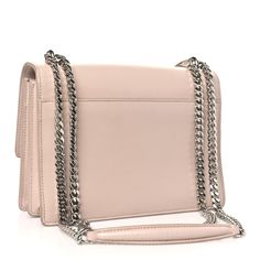 This is an authentic SAINT LAURENT Calfskin Medium Monogram Sunset in Marble Pink. This stunning shoulder bag is crafted of smooth calfskin in a soft beige with a pink hue. The bag features a matching shoulder strap with silver chain, a front facing flap with a signature YSL logo, gusseted sides, and both an interior and exterior pocket. This fold over bag is complete with magnetic snap that opens to a spacious suede leather interior. Marble Pink, Ysl Logo, Soft Beige, Pink Marble, Leather Interior, Fold Over, Suede Leather, Interior And Exterior, Silver Chain