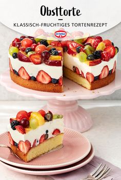 there is a cake with strawberries on the top and two slices missing from it