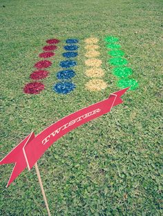 a red arrow is in the middle of a field that has been decorated with different colors