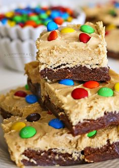 three pieces of brownie with m & m candy on top