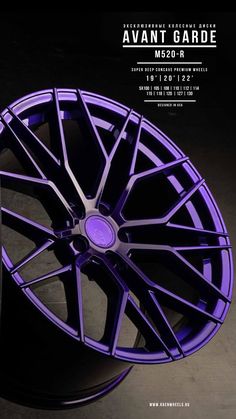 a purple wheel is shown in front of a black background with the words avantt garde on