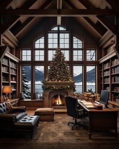 a living room filled with lots of furniture and a christmas tree in the middle of it