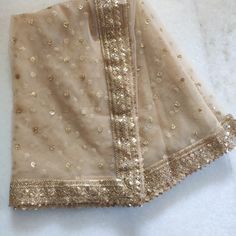 Golden Indian Dupatta party wear | Long net embroidered scarf | Punjabi dress dupattas with zari embroidery for lehenga | Dupatta This Dupatta is sequin embroidered on net with beautiful golden border. This can be your wedding dress chunni for Indian occasion wear for festival. This has perfect bling for you to look classy and ethnic at same time. This can even be your home decoration fabric for you can even wear them with lehenga. This can be made in any color. We can even make a jacket or ponc Cheap Chanderi Dupatta For Festivals, Luxury Net Dupatta With Traditional Drape, Luxury Slub Silk Dupatta With Embroidered Border, Luxury Dupatta With Zari Work For Eid, Luxury Chinon Dupatta With Handwork, Luxury Gold Dupatta With Chikankari Embroidery, Luxury Ceremonial Dupatta With Dori Work, Luxury Resham Embroidered Dupatta For Celebration, Luxury Net Dupatta With Lace Work