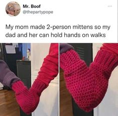 someone is holding their arm up in the air while wearing red knitted mittens