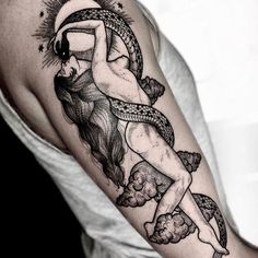 a woman with a sun and moon tattoo on her arm is holding onto a rope