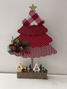 a christmas tree made out of fabric on top of a table