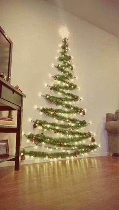 a living room with a christmas tree on the wall