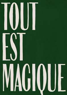 a green sign that says tour est magique with white lettering on it's side