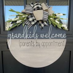 a welcome sign hanging on the front door of a house that says, grandkids welcome parents by appointment