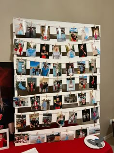 a table with pictures and magnets on it next to a red table cloth covered table