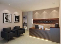 the front desk of an office with two black chairs and a wooden sign on the wall