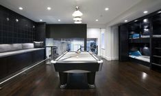 a pool table is in the middle of a room