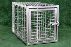 a metal cage is shown on the grass