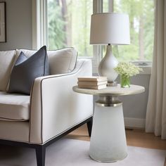 a living room scene with focus on the end table and chair, which has a lamp next to it