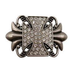 an antique style ring with diamonds on the front and center, set in silver metal