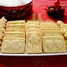 some cookies are arranged on a white plate