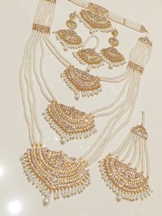 an assortment of necklaces and earrings on display