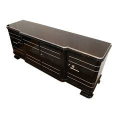 a large black cabinet with drawers on one side and an open drawer on the other