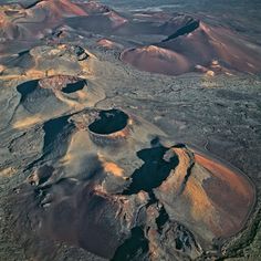 an aerial view of mountains and valleys in the desert