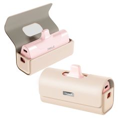 two white and pink items are sitting in a box on a white surface, one has a camera attached to it