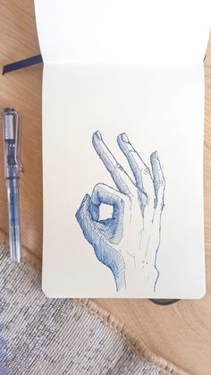 a drawing of a hand holding something in it's palm on top of a piece of paper