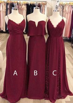 three bridesmaid dresses in different colors and sizes on mannequins at a store